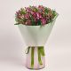 Elegant bouquet with vibrant pink flowers in a pastel wrap, flowers theme.